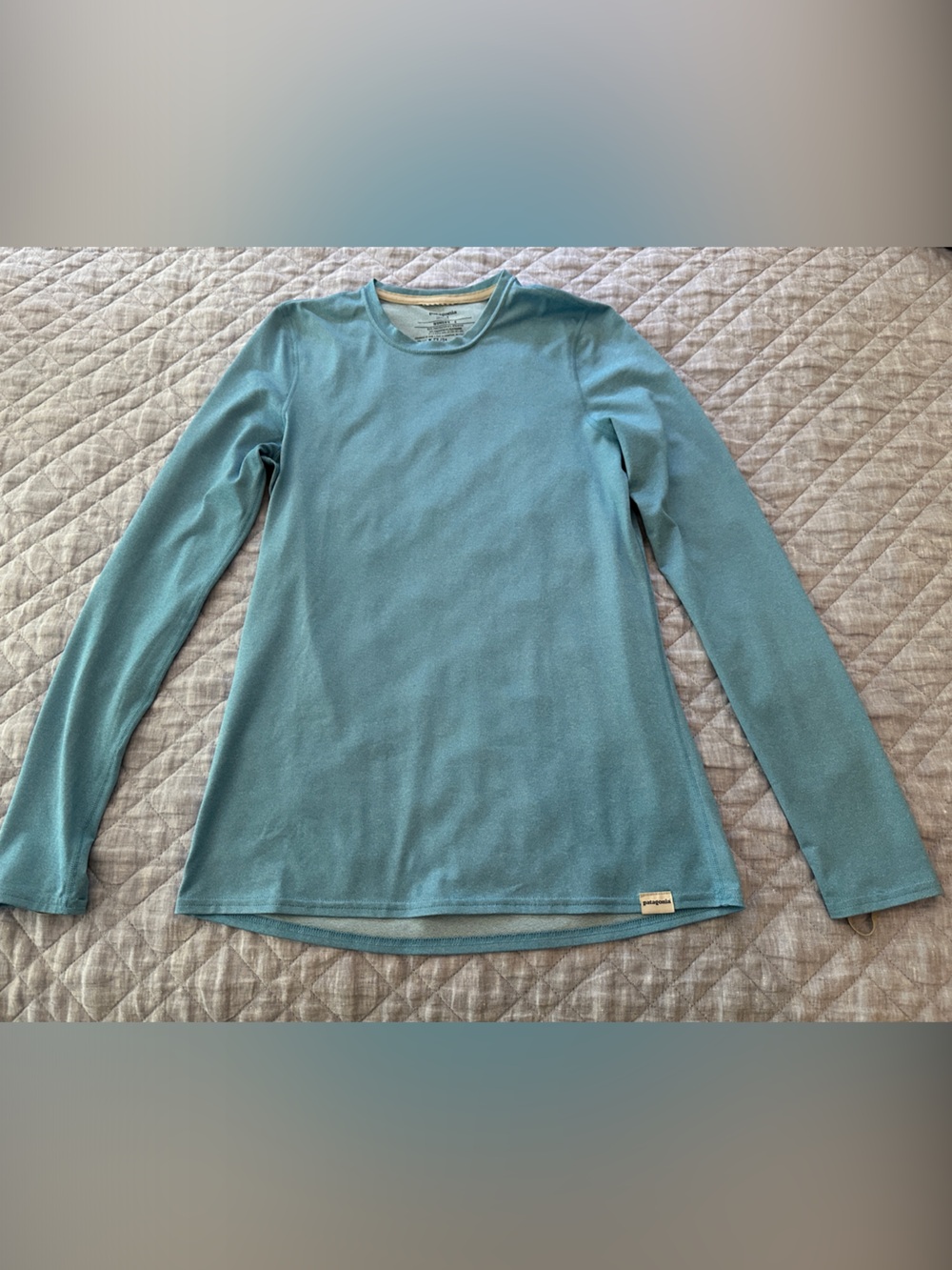 Patagonia Women's Capilene long-sleeve top in Teal